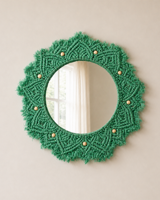 Green woven mirror with bead accents on a beige wall